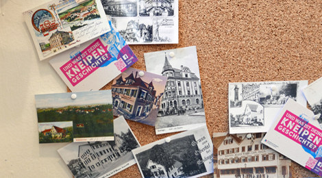 Pinnwand mit älteren Postkarten von Gaststätten in Esslingen.